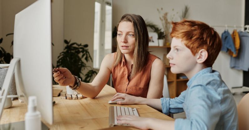 Smart Classrooms - Photo Of Woman Tutoring Young Boy