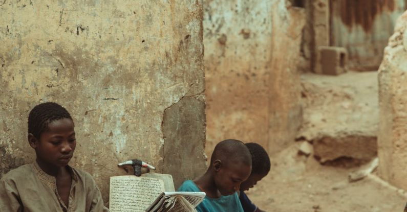 Peer Learning - Children sitting on the ground reading books