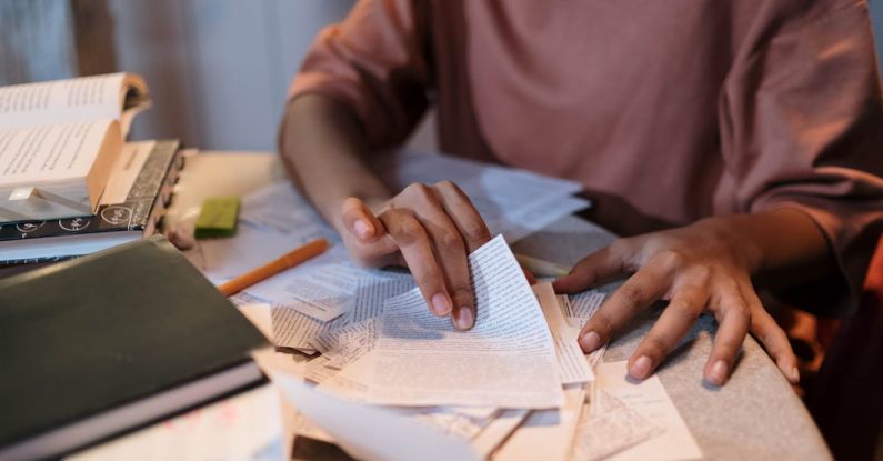 Open-Book Exams - Girl Sitting at the Table with Textbooks and Studying